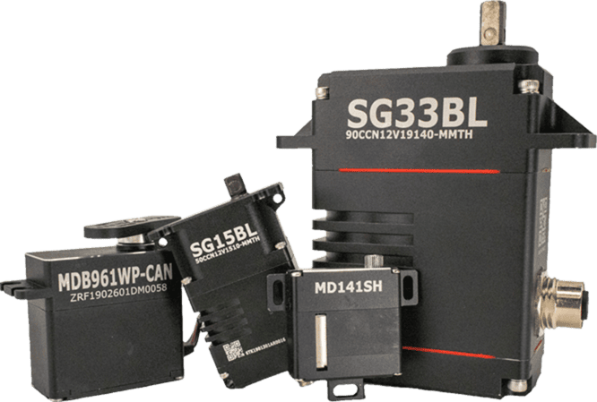 Product lineup photograph of four Hitec Commercial Solutions servo actuators (SG33BL, SG15BL, MDB961WP-CAN, and MD141SH), the precision motion hardware at the centre of the program.