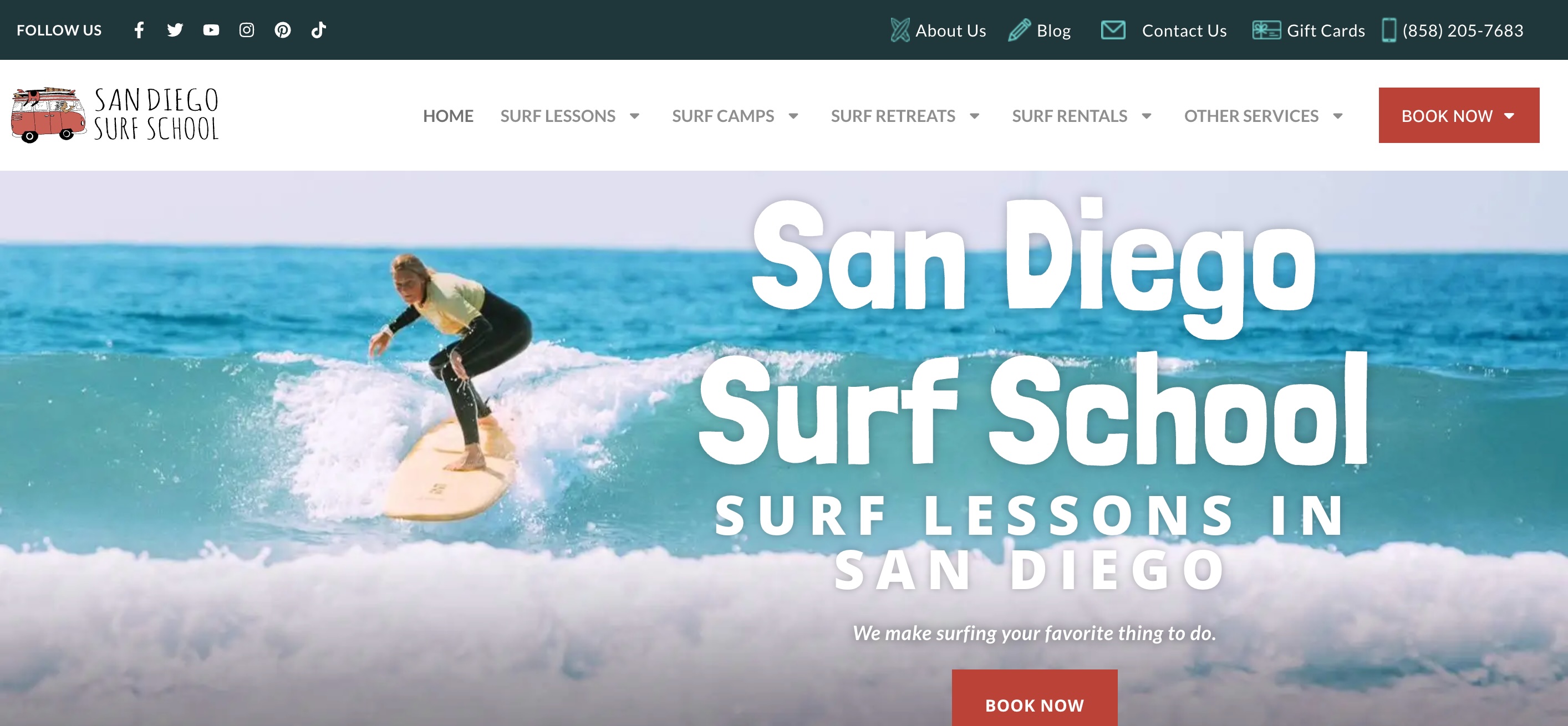 San Diego Surf School WordPress homepage showing a surfer riding a wave with the full site navigation — Surf Lessons, Surf Camps, Surf Retreats, Surf Rentals — and a prominent Book Now call-to-action, representing the rebuilt platform after migration from Shopify.